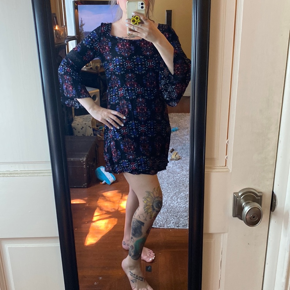 Small, floral print, mini dress. 3/4 bell sleeves with lace.